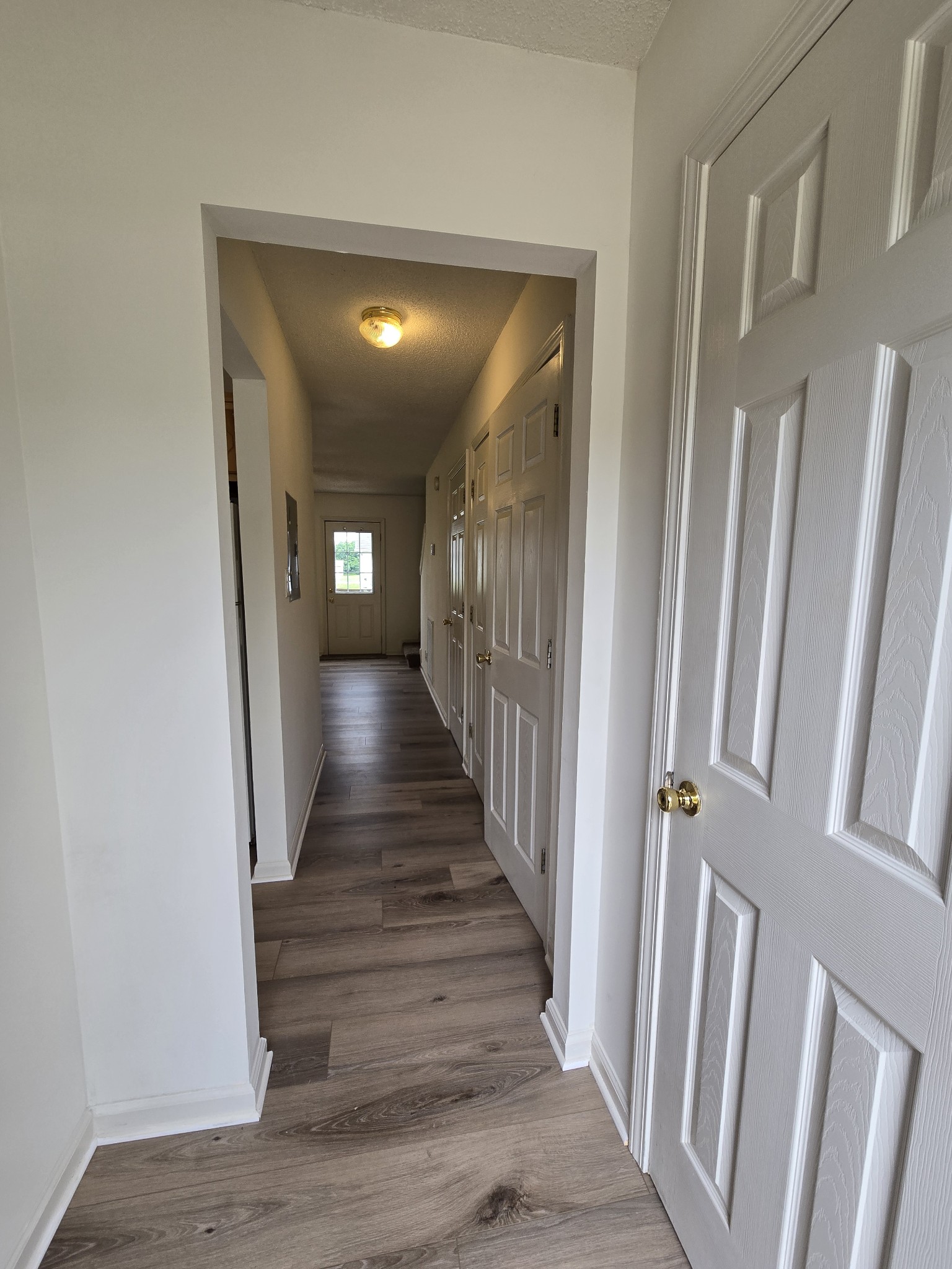 237 State Line Road Oak Grove, KY 42262 - Photo 3 of 20 a view of a hallway with wooden floor and staircase