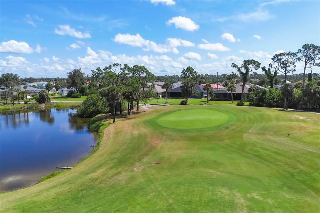 760 Rotonda Circle Rotonda West, FL 33947 - Photo 13 of 30 a view of a lake with a house in the background