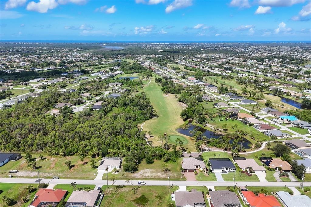 760 Rotonda Circle Rotonda West, FL 33947 - Photo 17 of 30 an aerial view of residential houses with outdoor space