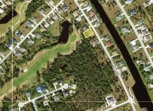 a view of swimming pool with a yard and seating area