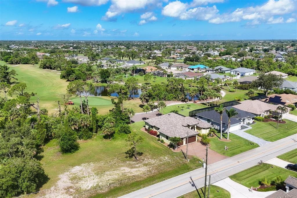 760 Rotonda Circle Rotonda West, FL 33947 - Photo 5 of 30 a view of a lake with a yard