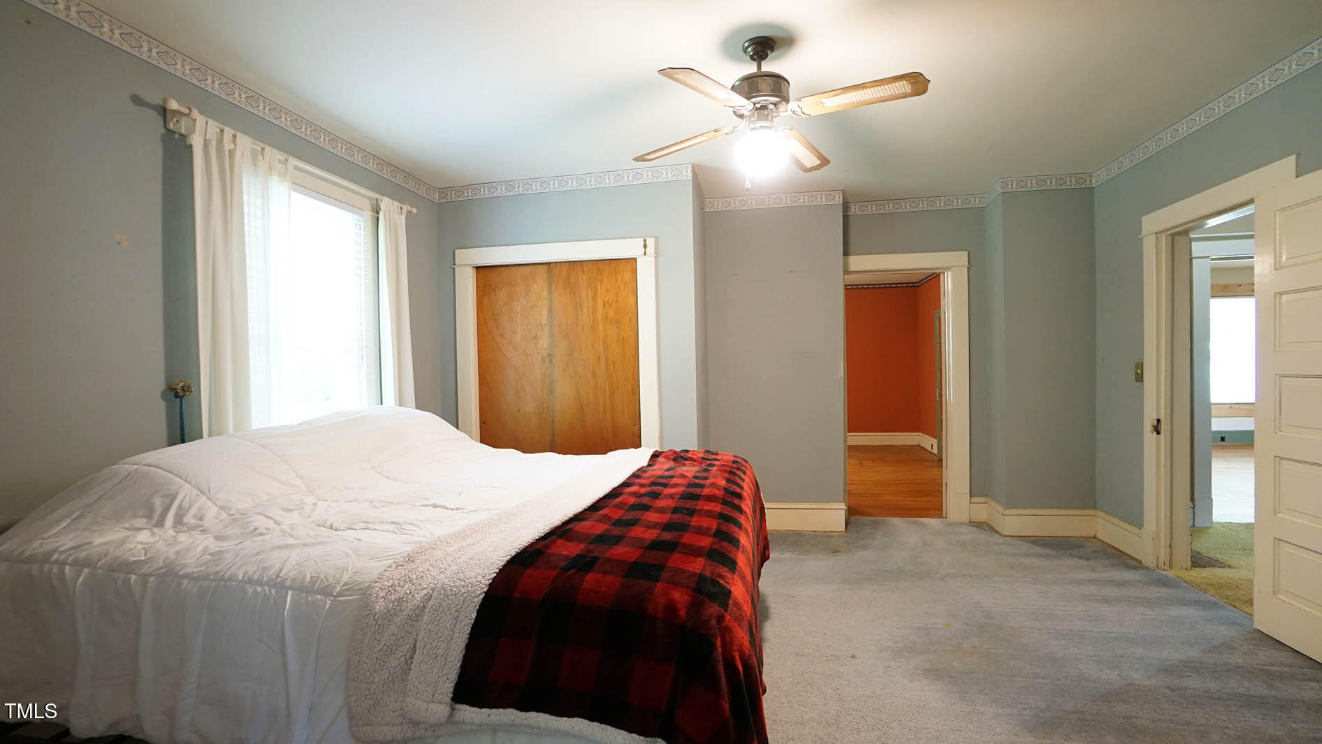 131 King Road Warrenton, NC 27589 - Photo 20 of 67 a bedroom with a bed and a chandelier