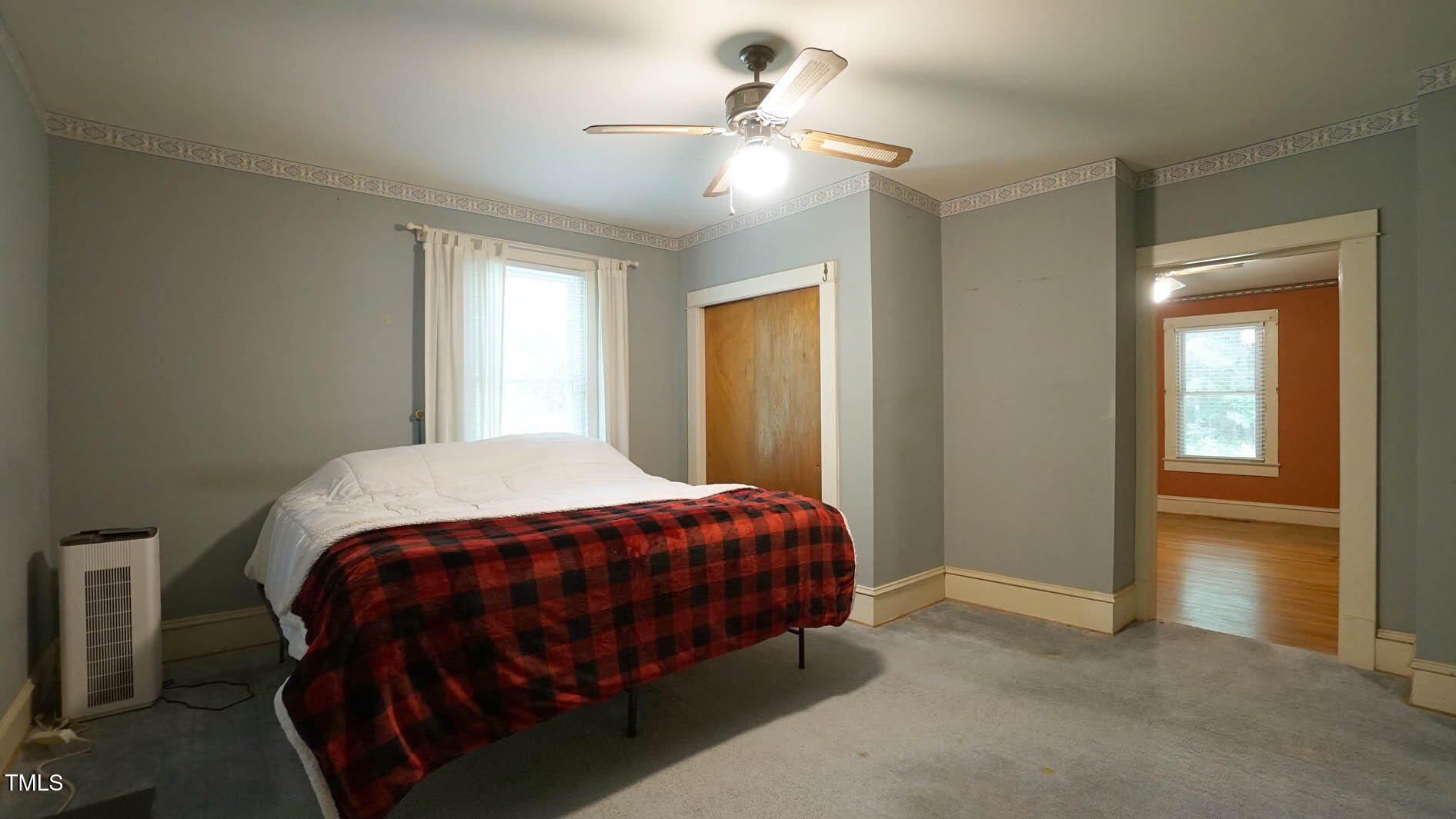 131 King Road Warrenton, NC 27589 - Photo 22 of 67 a bedroom with a bed and a chandelier