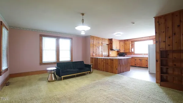 a kitchen with a stove and a refrigerator