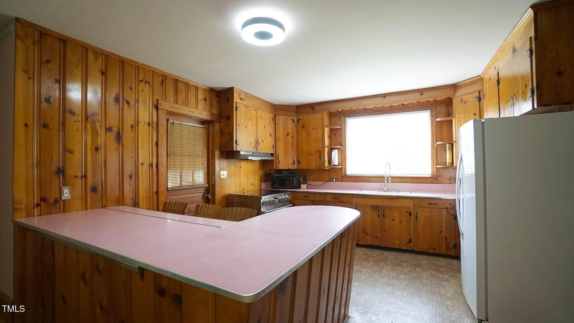 131 King Road Warrenton, NC 27589 - Photo 37 of 67 a kitchen with kitchen island a sink table and chairs