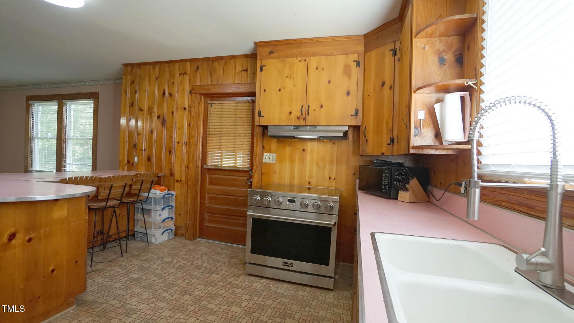 131 King Road Warrenton, NC 27589 - Photo 44 of 67 a kitchen with a stove and a refrigerator
