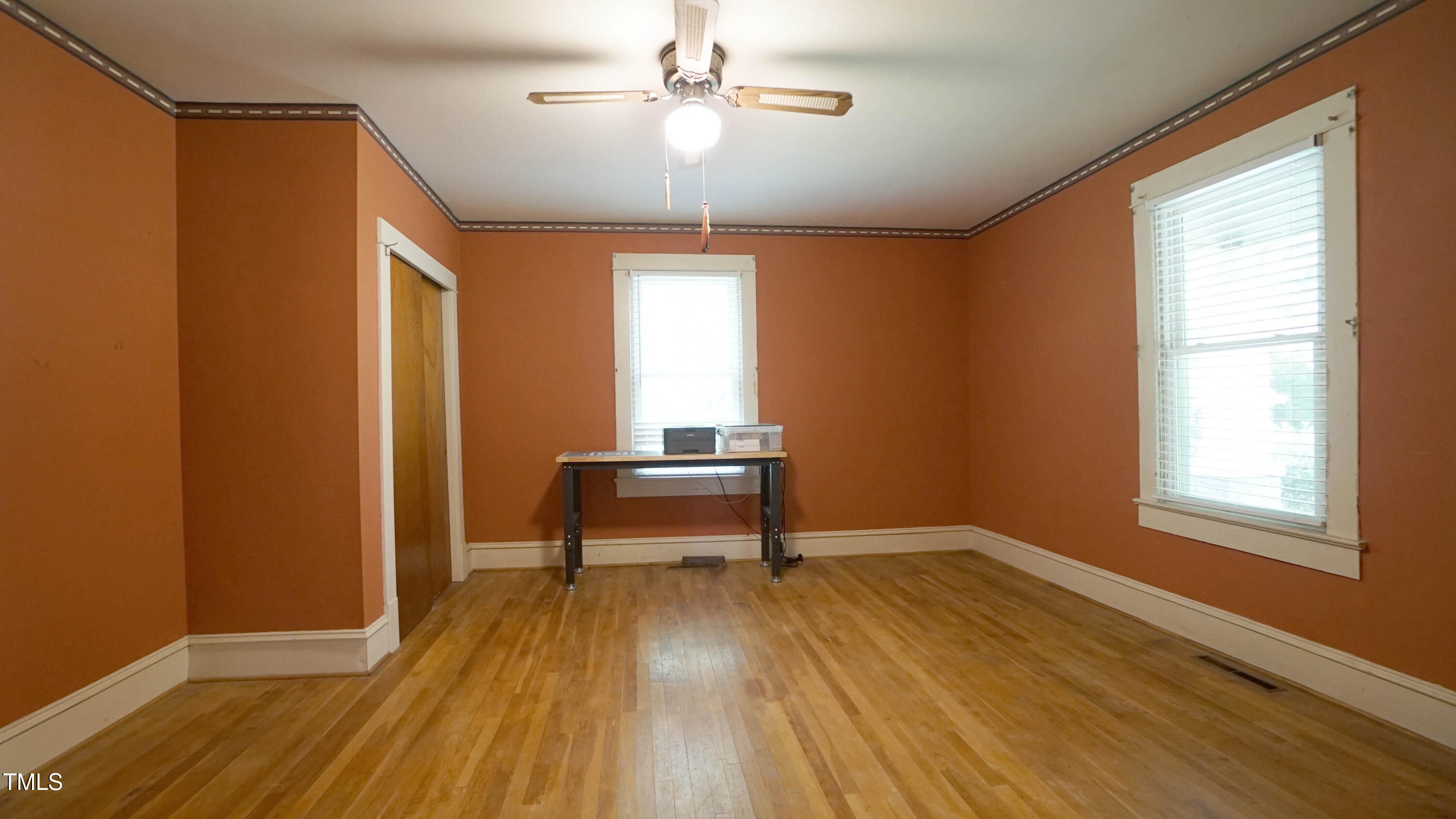 131 King Road Warrenton, NC 27589 - Photo 47 of 67 a view of a livingroom with wooden floor and a ceiling fan