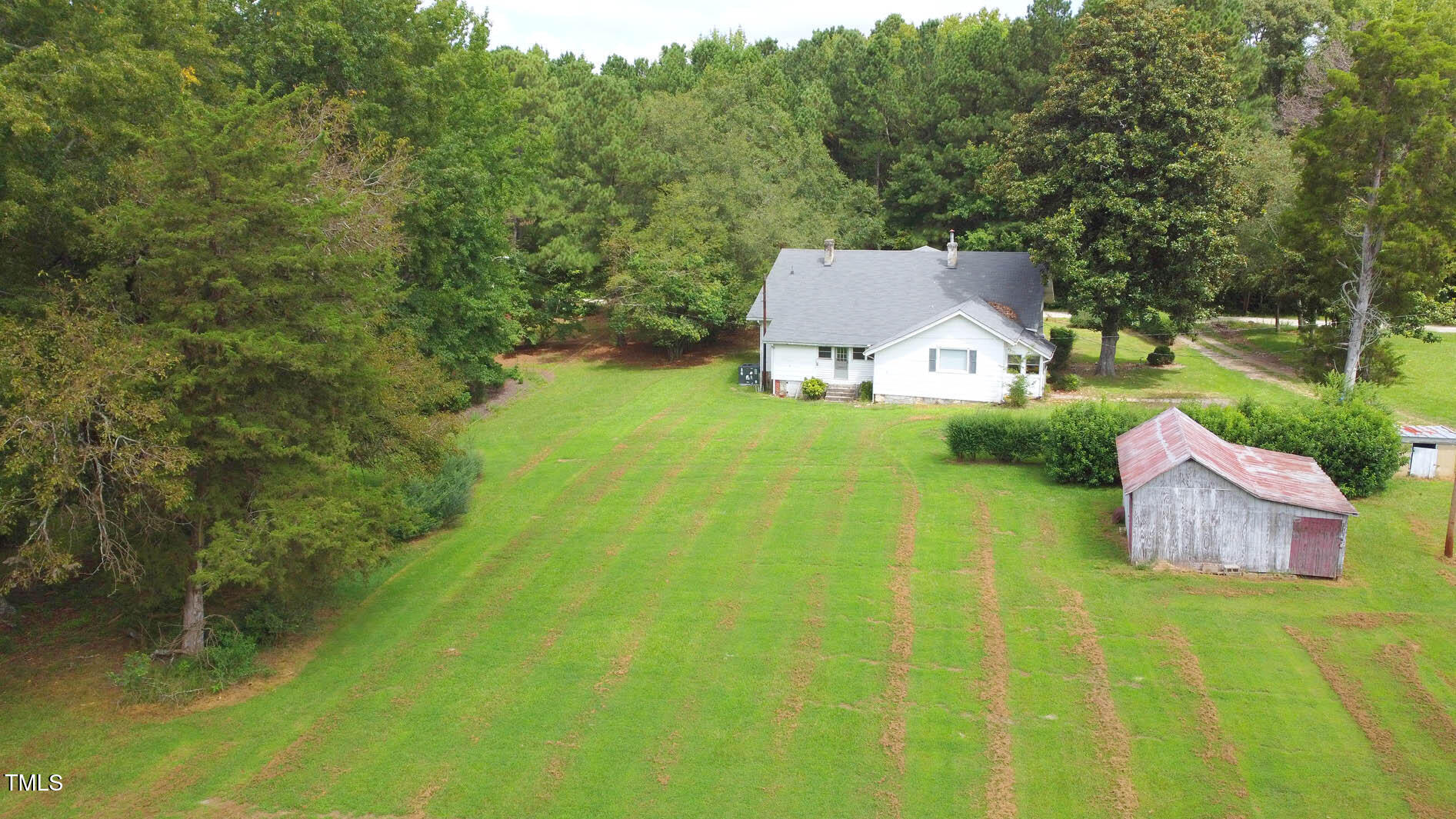 131 King Road Warrenton, NC 27589 - Photo 9 of 67 a view of a house with a yard and a large tree