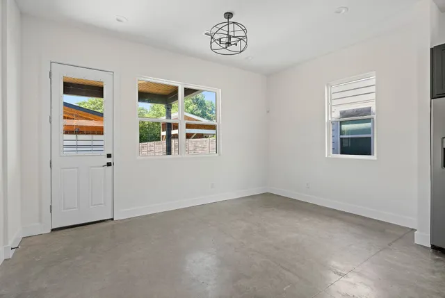 a view of an empty room with a window