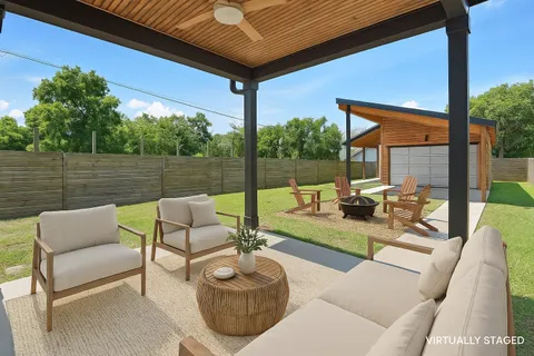 a view of a backyard with brick wall