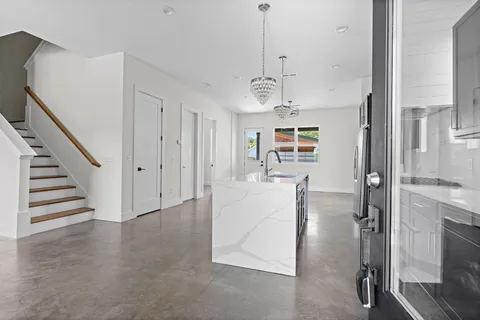 a view of kitchen with cabinets and stainless steel appliances