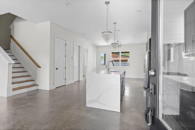 a view of kitchen with cabinets and stainless steel appliances