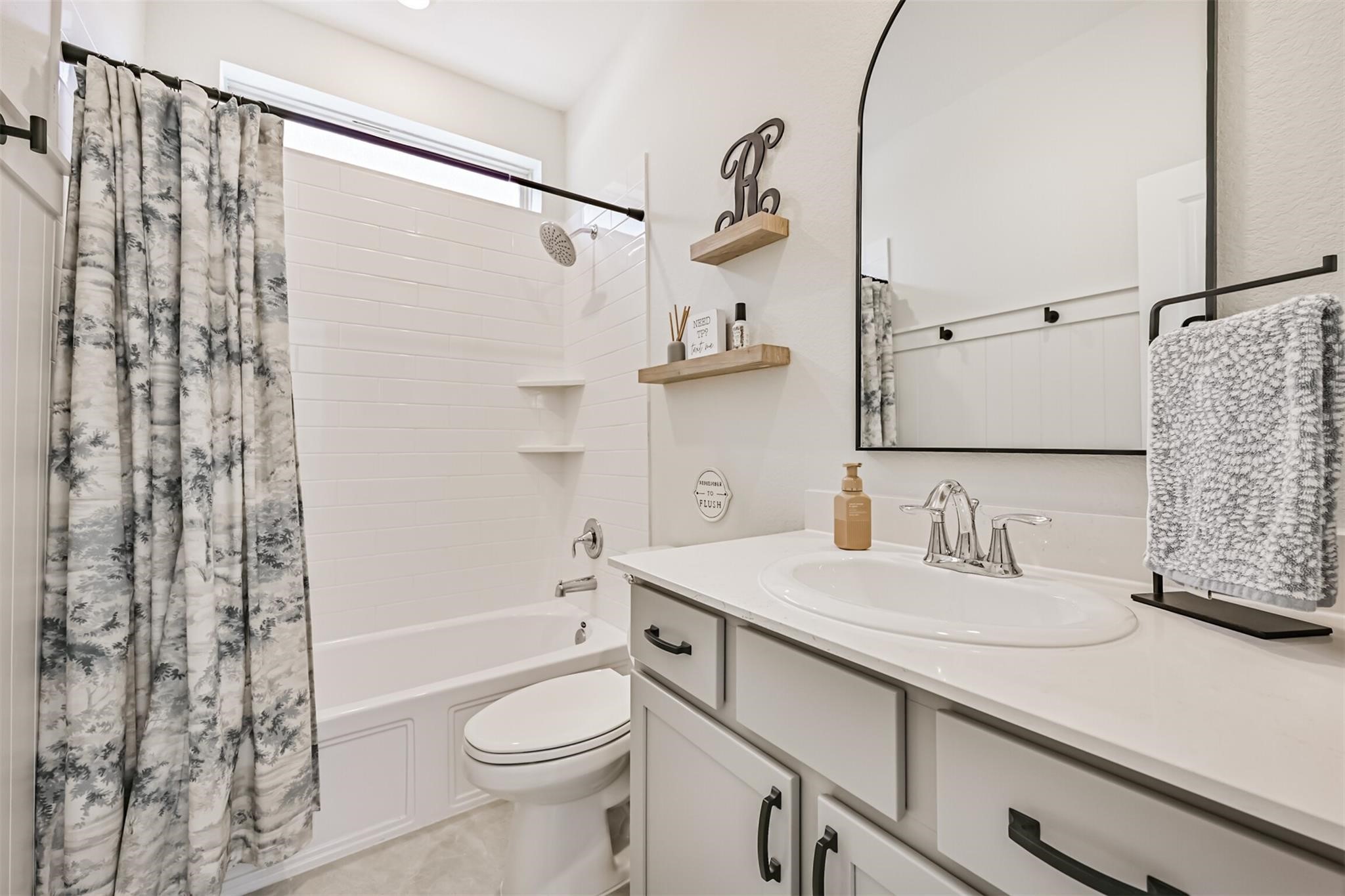 5010 Walnut Grv Lane Manvel, TX 77578 - Photo 12 of 46 a bathroom with a sink a toilet and shower