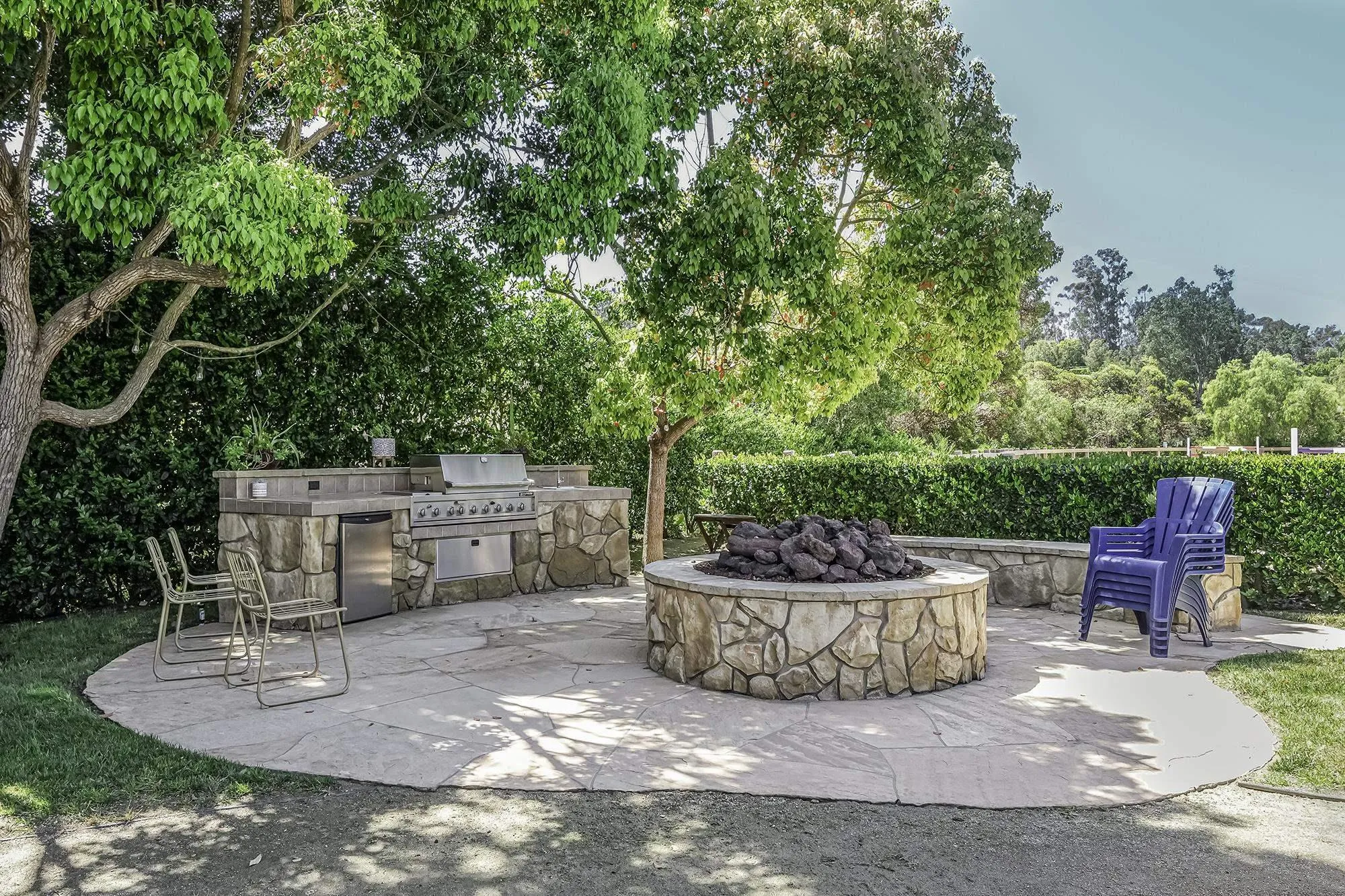 5305 La Crescenta Road Rancho Santa Fe, CA 92067 - Photo 15 of 64 Great entertaining down at the barn area with the fire pit, and full BBQ bar with side-burner and refrigerator