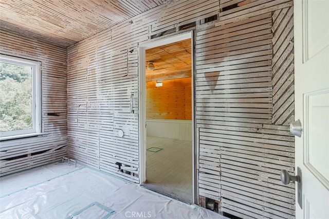 a view of a porch with wooden floor