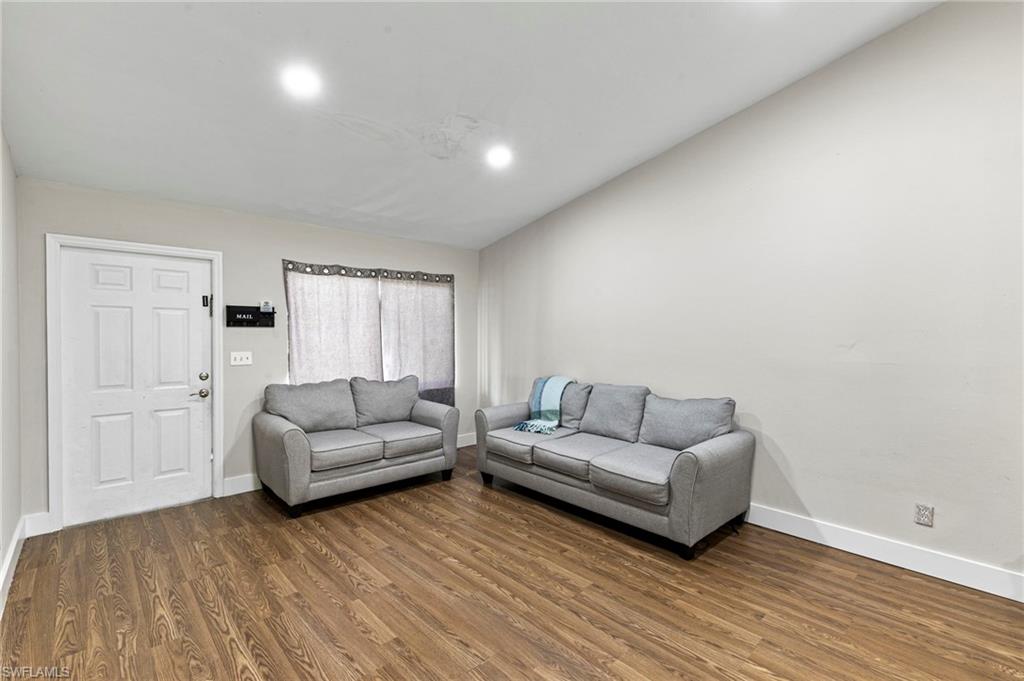 8264-8268 Matanzas Road Fort Myers, FL 33967 - Photo 17 of 33 a living room with furniture and a wooden floor