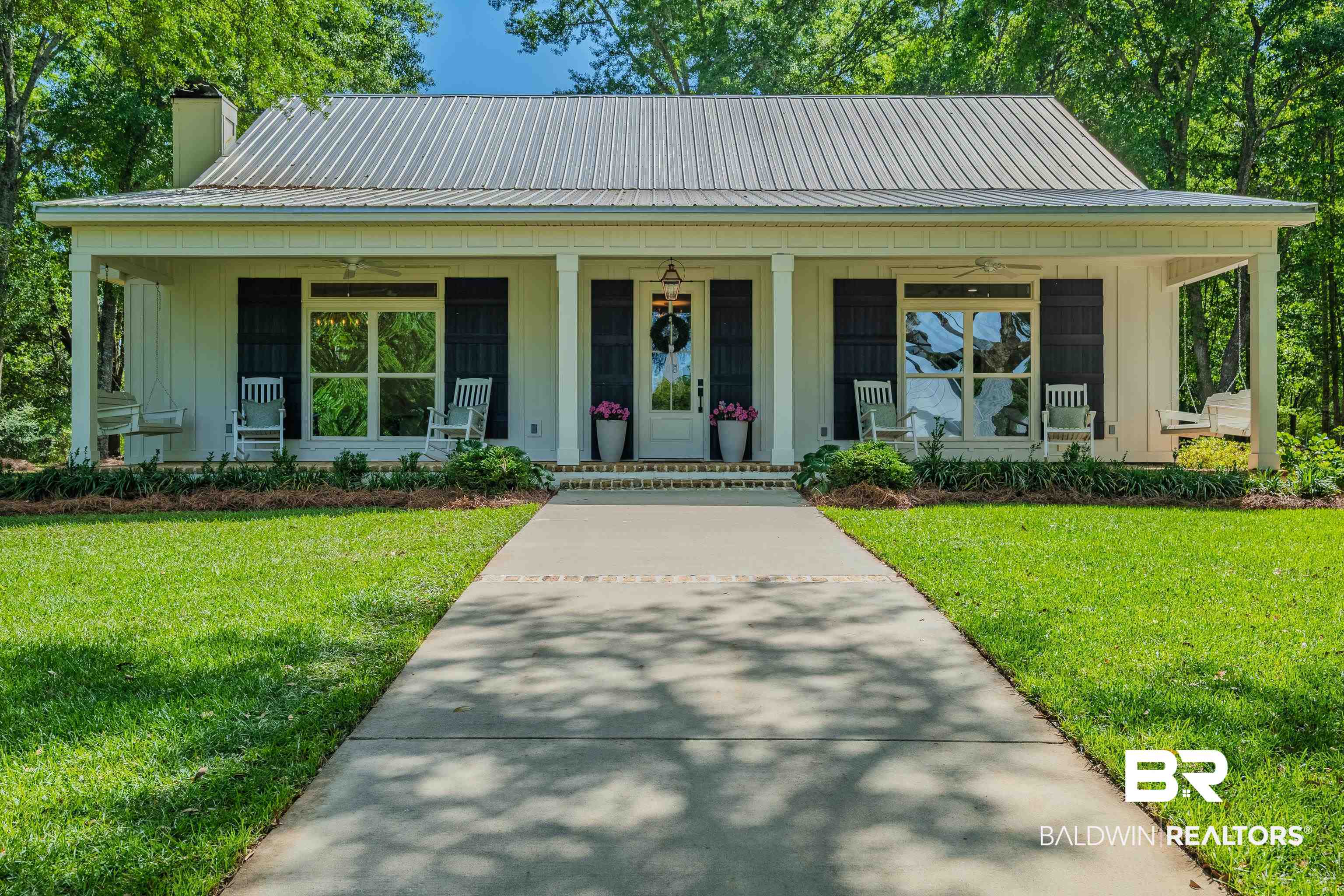 19121 Boothe Road Fairhope, AL 36532 - Photo 37 of 41 View of front facade with board and batten siding, covered porch, and ceiling fan