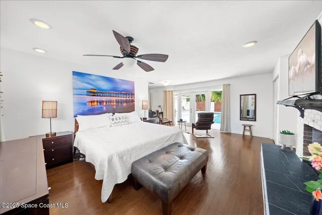 a bed room with a bed and a chandelier