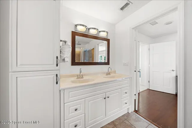 a bathroom with a tub and a window