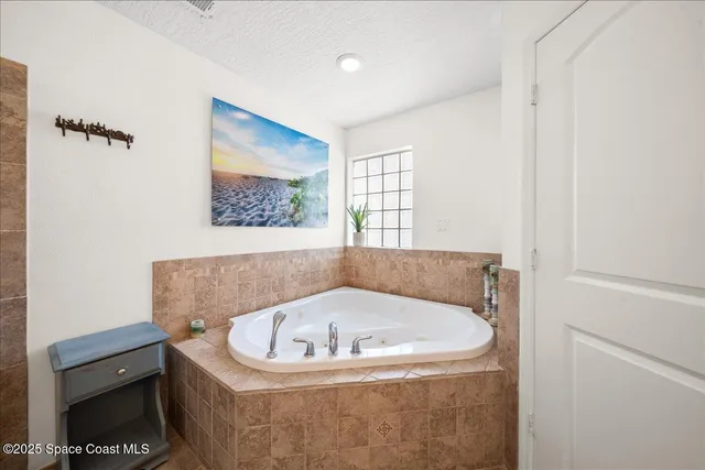 a bathroom with a shower sink and mirror