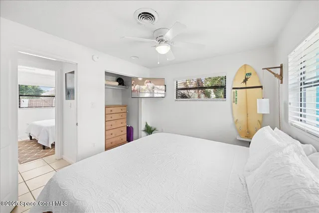 a view of backyard of house with seating space