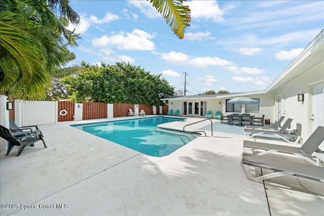 a front view of a house with garden and porch