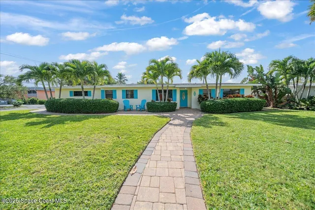 a room with furniture pool table gym equipment wooden floor and windows