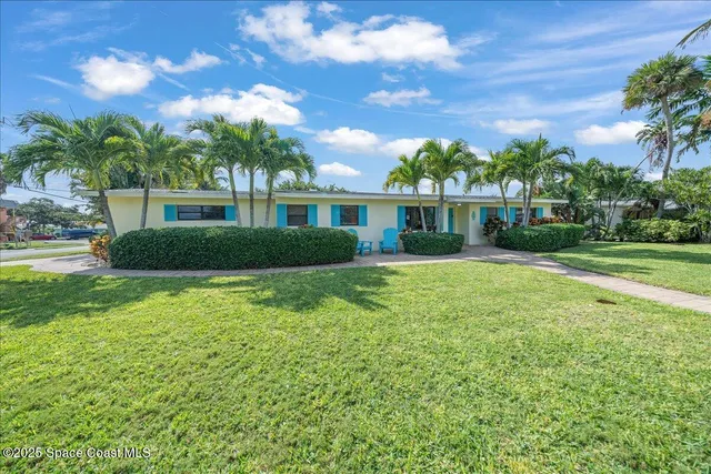 a view of a street with a building in the background