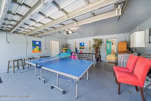 a view of a patio with table and chairs potted plants