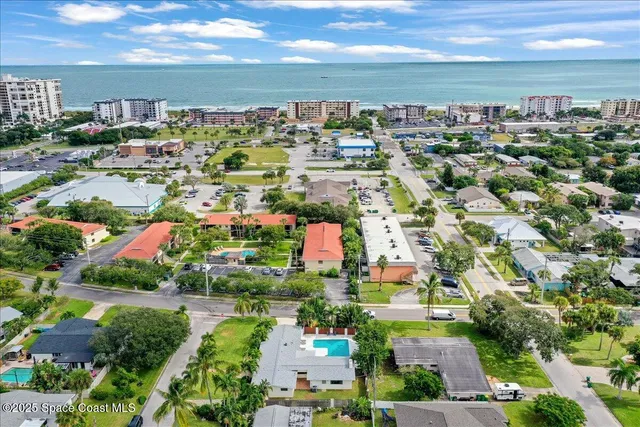 a view of a patio with table and chairs