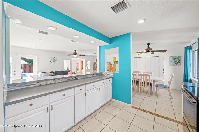 a spacious bathroom with a granite countertop sink a mirror and a