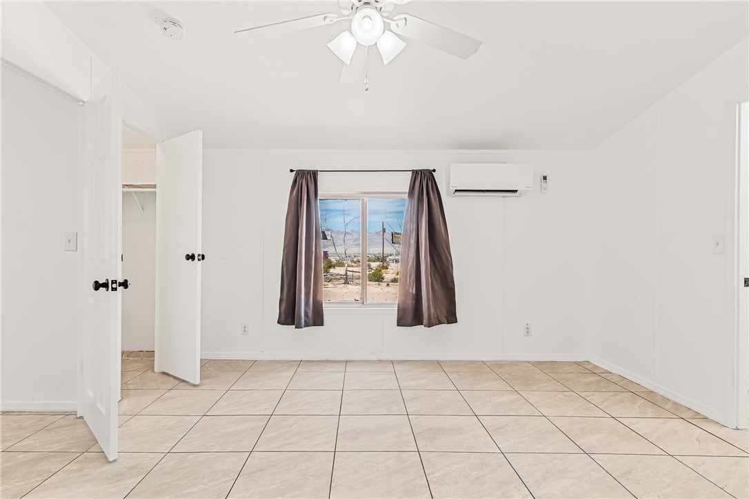 1655 Dunlap Road Fort Mohave, AZ 86426 - Photo 19 of 37 a view of a livingroom with a chandelier fan and wooden floor