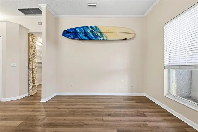 a spacious bathroom with a granite countertop sink a toilet a mirror and vanity