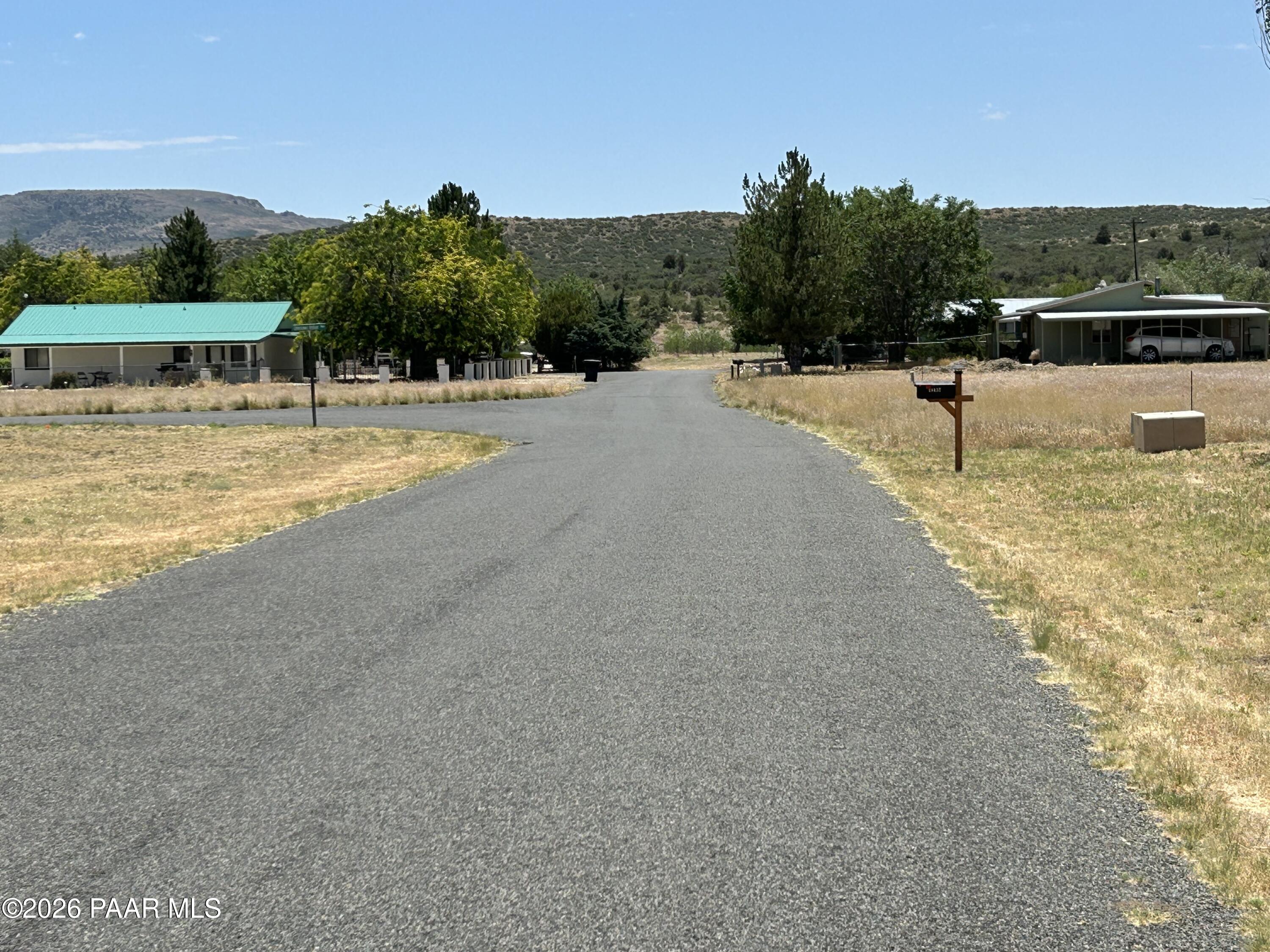 18628 Joseph Hodge Road Peeples Valley, AZ 86332 - Photo 8 of 18 a view of a swimming pool with a yard