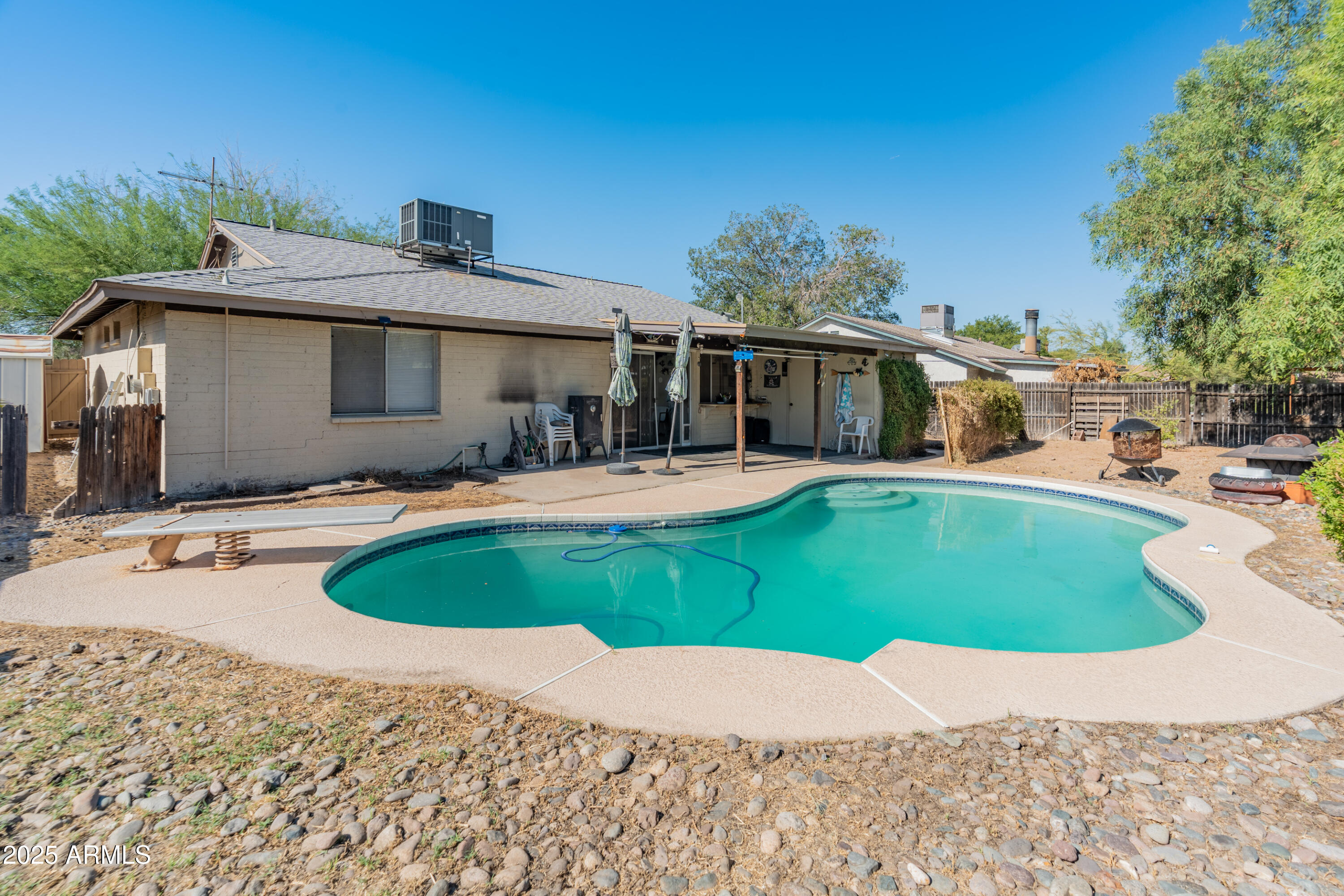 5506 West Hatcher Road Glendale, AZ 85302 - Photo 3 of 23 a swimming pool with outdoor seating and yard