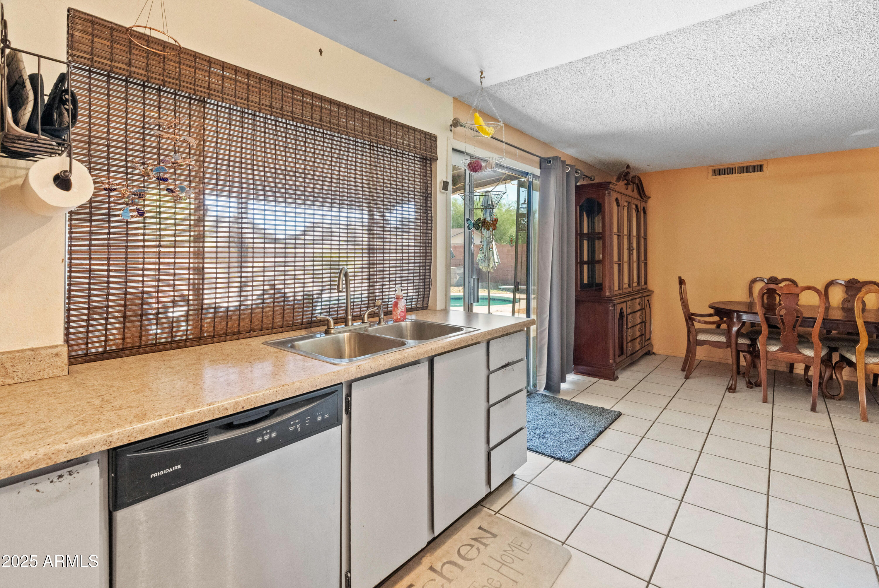 5506 West Hatcher Road Glendale, AZ 85302 - Photo 8 of 23 a kitchen with a sink and cabinets