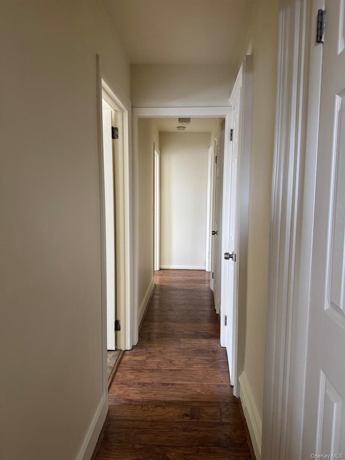 41 Clove Road Salisbury Mills, NY 12577 - Photo 14 of 24 a view of a hallway with wooden floor and a bathroom