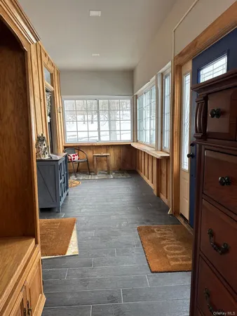 a room with wooden floor and furniture