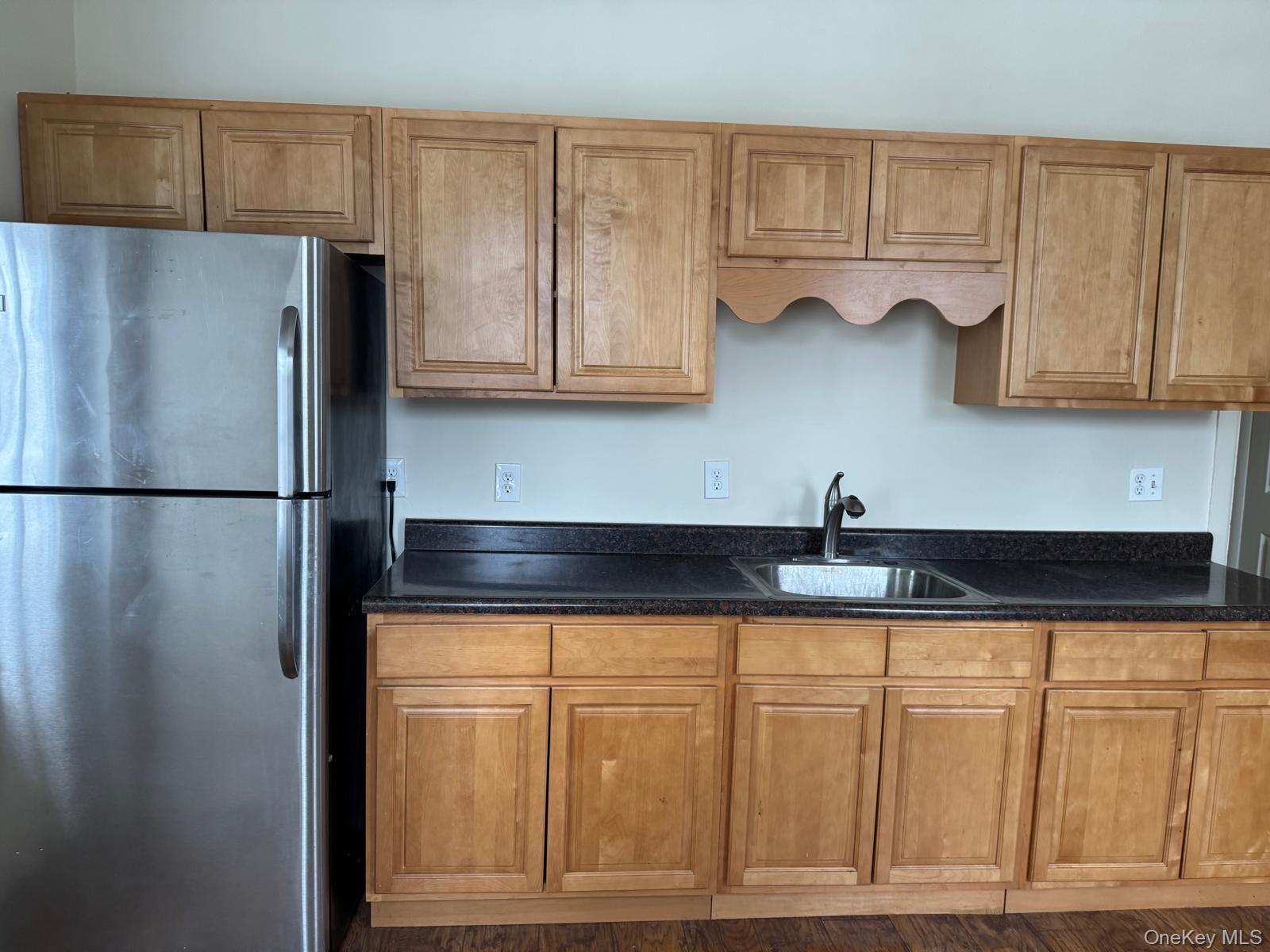 41 Clove Road Salisbury Mills, NY 12577 - Photo 8 of 24 a kitchen with granite countertop a refrigerator and cabinets