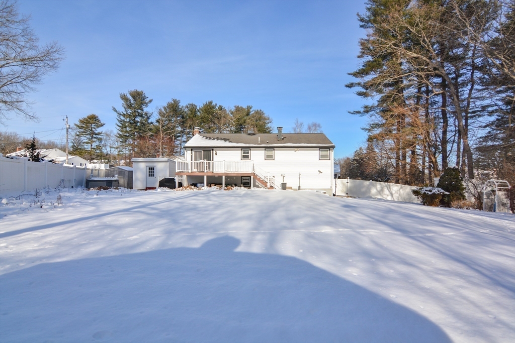 51 Heritage Road Billerica, MA 01821 - Photo 22 of 32 a view of a house with a snow in the yard