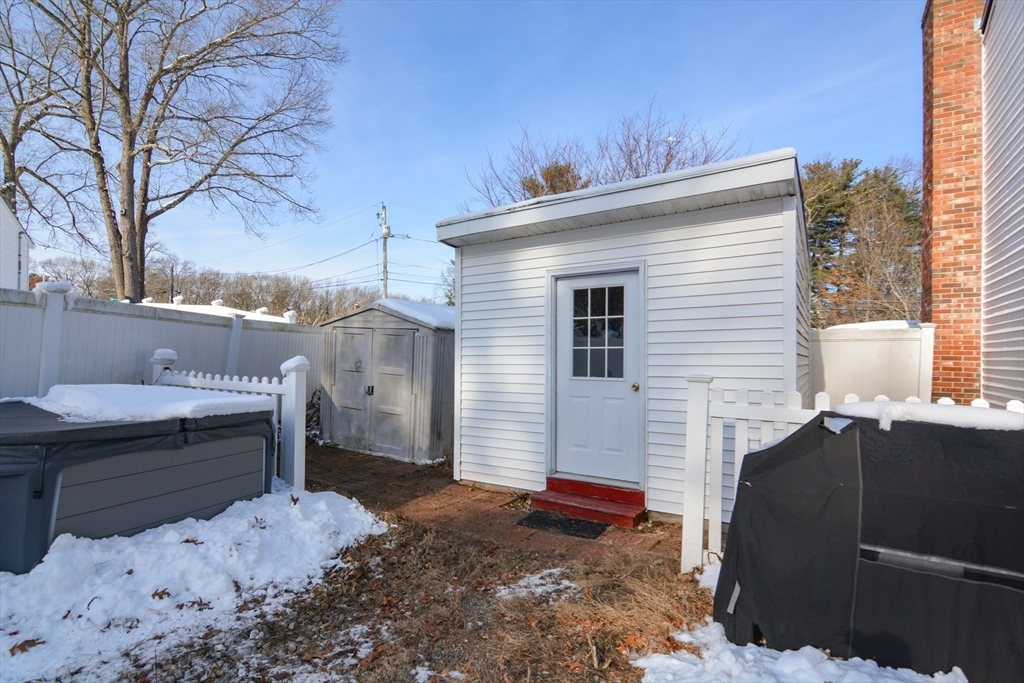 51 Heritage Road Billerica, MA 01821 - Photo 28 of 32 a view of a house with a bed and chair