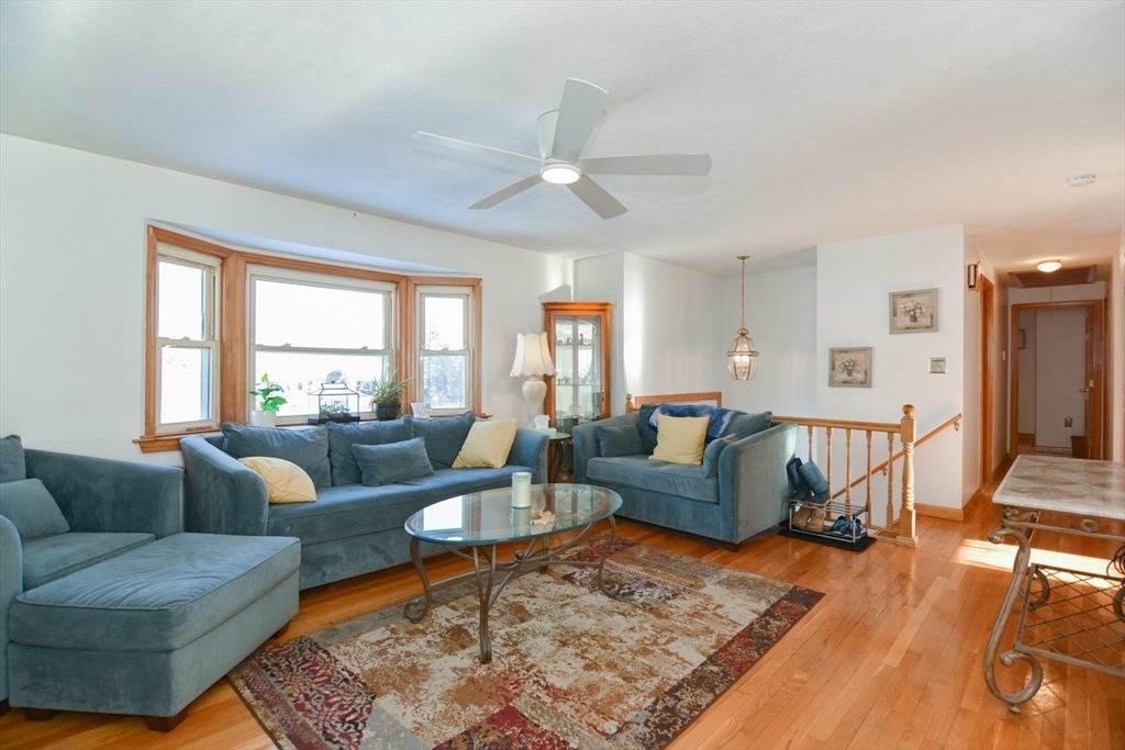 51 Heritage Road Billerica, MA 01821 - Photo 3 of 32 a living room with furniture and a large window