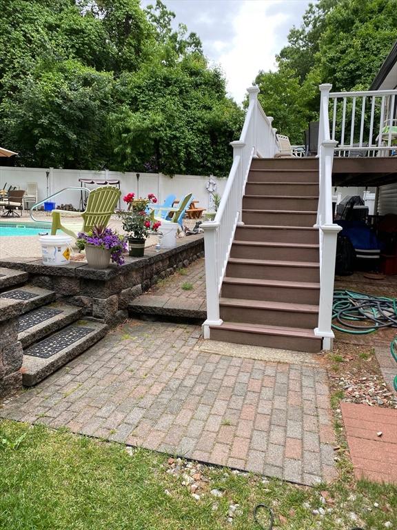 51 Heritage Road Billerica, MA 01821 - Photo 32 of 32 a view of backyard with a deck and a garden