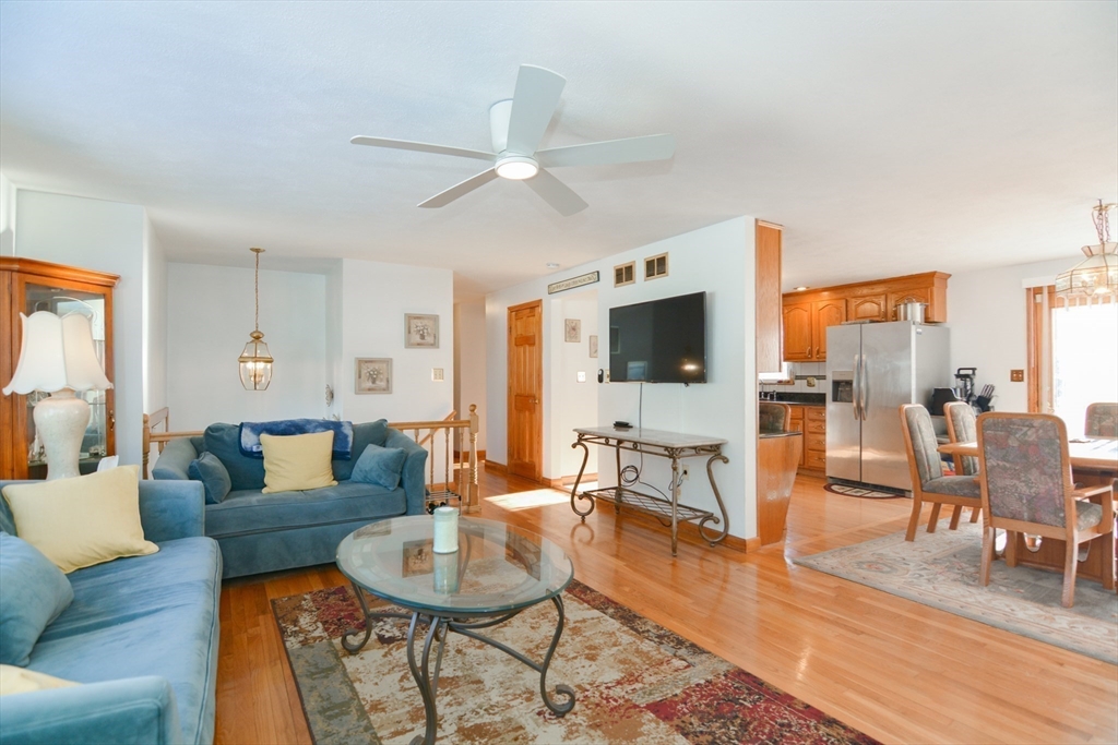51 Heritage Road Billerica, MA 01821 - Photo 5 of 32 a living room with furniture and a flat screen tv