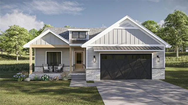 a front view of a house with a yard table and chairs