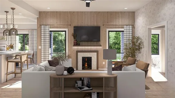 a living room with furniture a flat screen tv and a fireplace