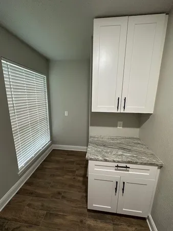 a view of kitchen island with wooden floor