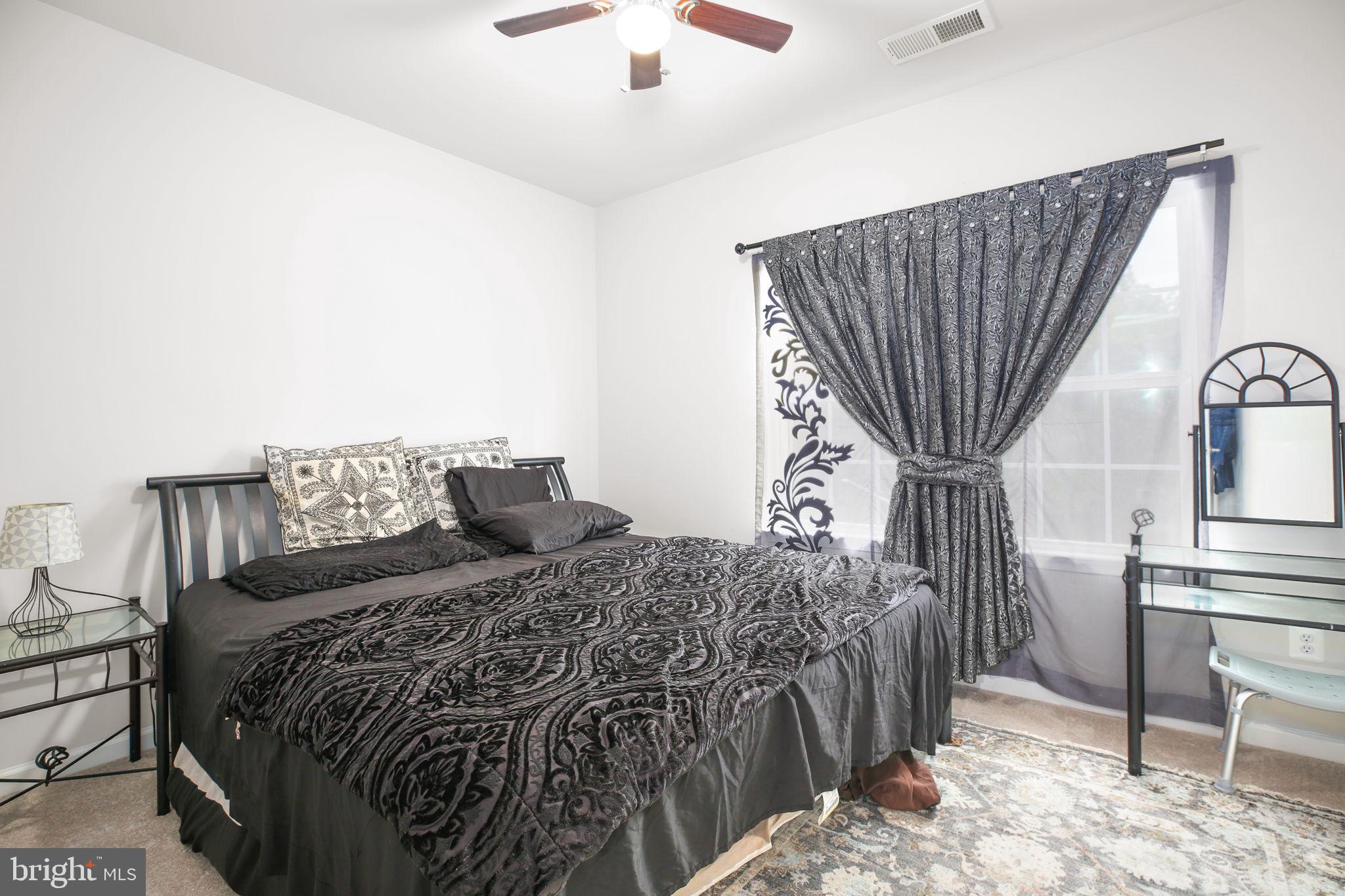 18353 Reaper Hl Court Triangle, VA 22172 - Photo 17 of 29 Bedroom with ceiling fan and carpet