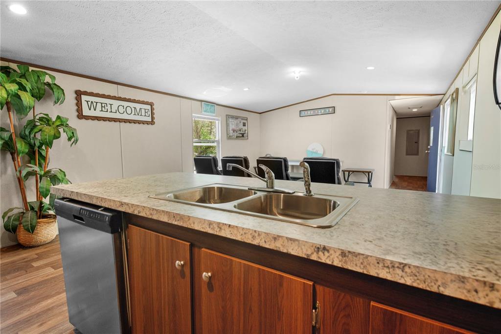 16770 Southwest 60th Place Ocala, FL 34481 - Photo 12 of 26 a kitchen with stainless steel appliances granite countertop a sink and a counter top space