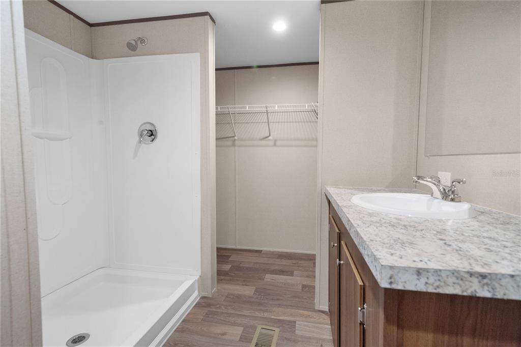 16770 Southwest 60th Place Ocala, FL 34481 - Photo 20 of 26 a bathroom with a granite countertop sink and mirror